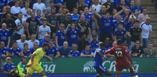 Liverpool goalkeeper Alisson reacts after being dispossessed by Kelechi Iheanacho of Leicester City