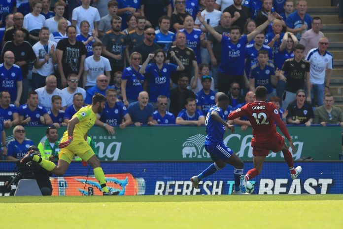 Liverpool goalkeeper Alisson reacts after being dispossessed by Kelechi Iheanacho of Leicester City