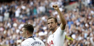 Harry Kane of Tottenham Hotspur celebrates scoring his side's third goal with Kieran Trippier during the Premier League match between Tottenham Hotspur and Fulham FC at Wembley Stadium on August 18, 2018 in London, United Kingdom.