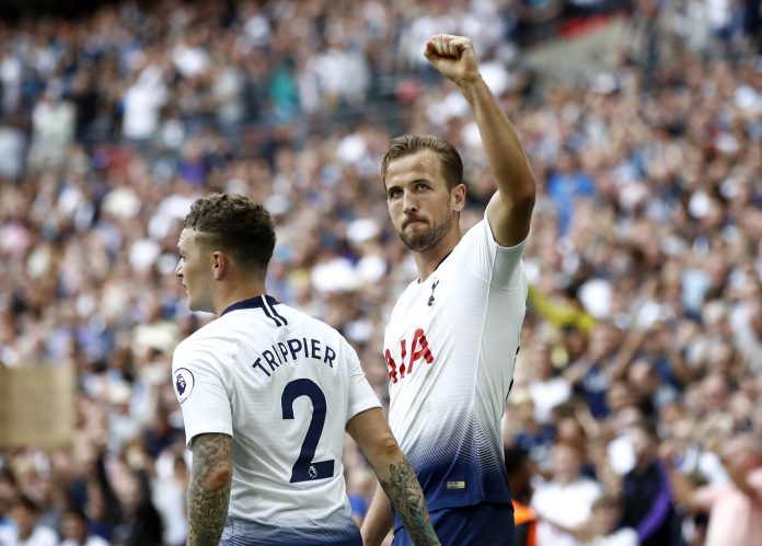 Harry Kane of Tottenham Hotspur celebrates scoring his side's third goal with Kieran Trippier during the Premier League match between Tottenham Hotspur and Fulham FC at Wembley Stadium on August 18, 2018 in London, United Kingdom.