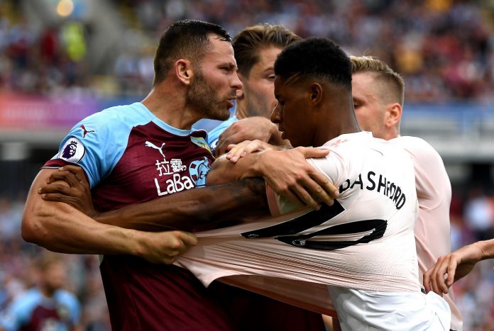 Marcus Rashford of Manchester United and Phil Bardsley of Burnley clash leading to a red card for Rashford during the Premier League match between Burnley FC and Manchester United