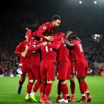 Roberto Firmino of Liverpool celebrates with team mates after scoring his sides second goal