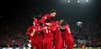 Roberto Firmino of Liverpool celebrates with team mates after scoring his sides second goal