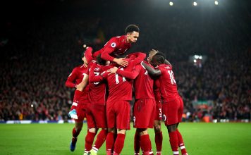 Roberto Firmino of Liverpool celebrates with team mates after scoring his sides second goal