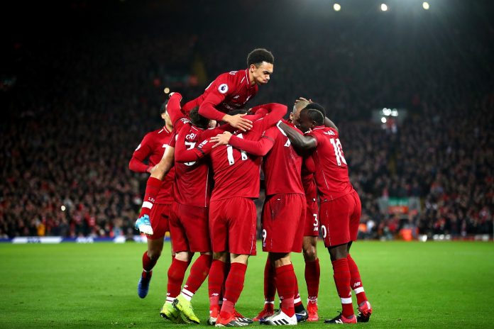 Roberto Firmino of Liverpool celebrates with team mates after scoring his sides second goal