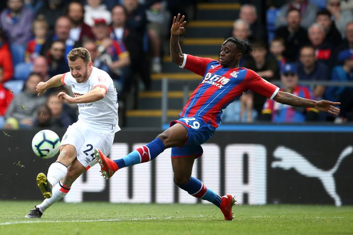 Aaron Wan-Bissaka of Crystal Palace is challenged by Ryan Fraser of AFC Bournemouth during the Premier League match between Crystal Palace and AFC Bournemouth