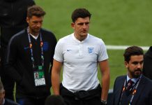 Harry Maguire walks on the pitch during England media access on the eve of their UEFA Nations League match.