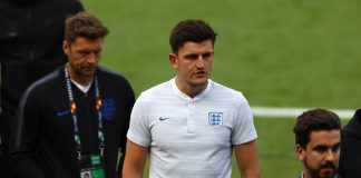 Harry Maguire walks on the pitch during England media access on the eve of their UEFA Nations League match.
