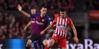 Rodri of Atletico Madrid evades Sergio Busquets of Barcelona during the La Liga match between FC Barcelona and Club Atletico de Madrid