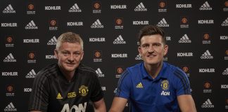 Harry Maguire of Manchester United poses with Manager Ole Gunnar Solskjaer after signing for the club