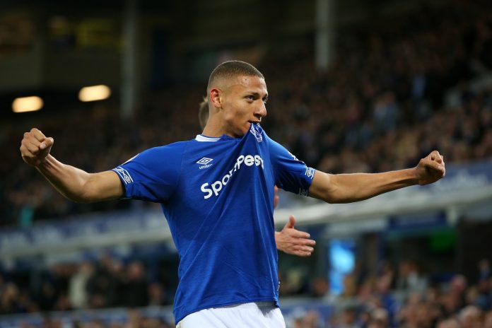 Richarlison of Everton celebrates after his team's first goal, an own goal by Ben Mee of Burnley during the Premier League match between Everton FC and Burnley FC