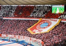 Fans of Bayern Munich show their logo prior to the DFB Cup final between RB Leipzig and Bayern Munchen at Olympiastadion