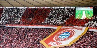 Fans of Bayern Munich show their logo prior to the DFB Cup final between RB Leipzig and Bayern Munchen at Olympiastadion