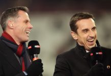 Pundits Jamie Carragher (L) and Gary Neville laugh prior to a Premier League match