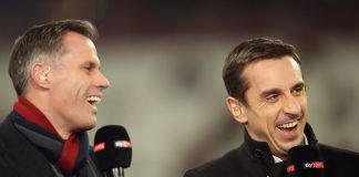 Pundits Jamie Carragher (L) and Gary Neville laugh prior to a Premier League match