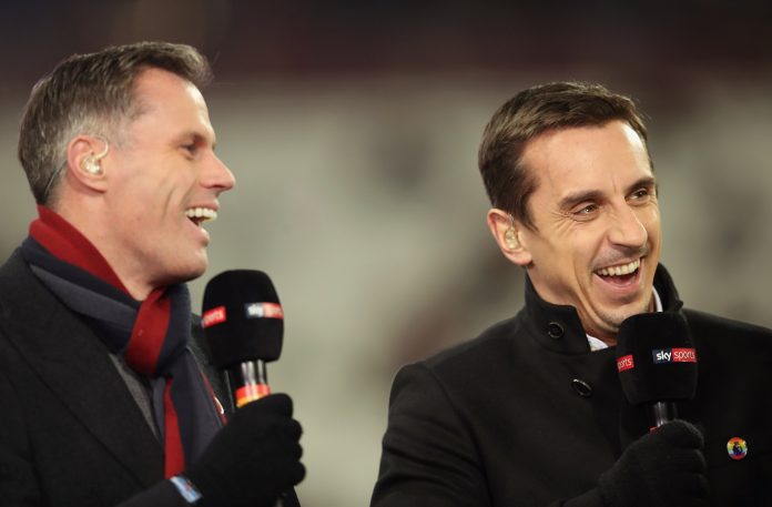 Pundits Jamie Carragher (L) and Gary Neville laugh prior to a Premier League match