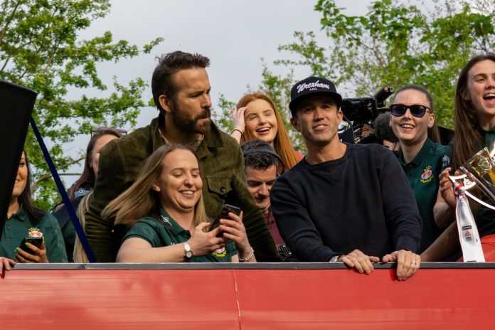 Ryan Reynolds and Rob McElhenney on the Wrexham AFC bus parade.
